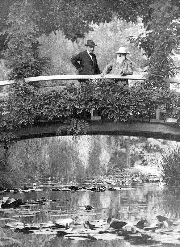Claude Monet - Monet, right, in his garden at Giverny, 1922