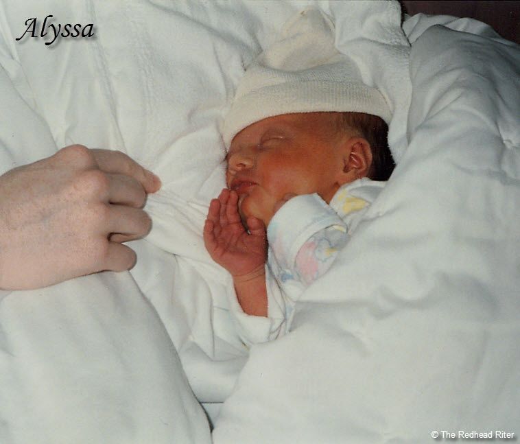 My hand and newborn Alyssa