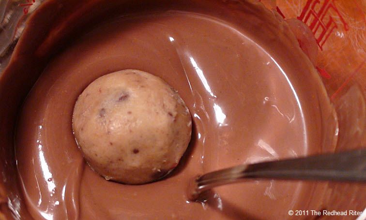 drop ball into melted chocolate