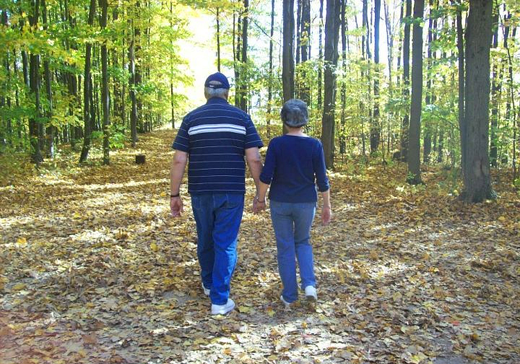 Miss Dottie and Big George walking hand-in-hand