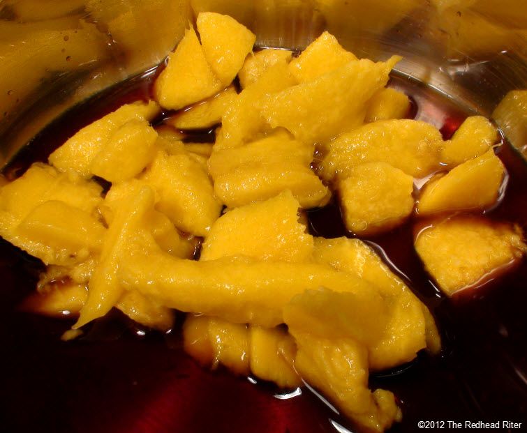balsamic vinegar, water and mango in a small sauce pan