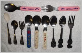 baby and children spoons and forks in a row