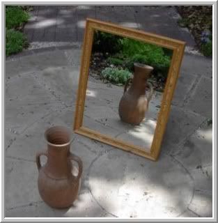 vase reflecting in a mirror